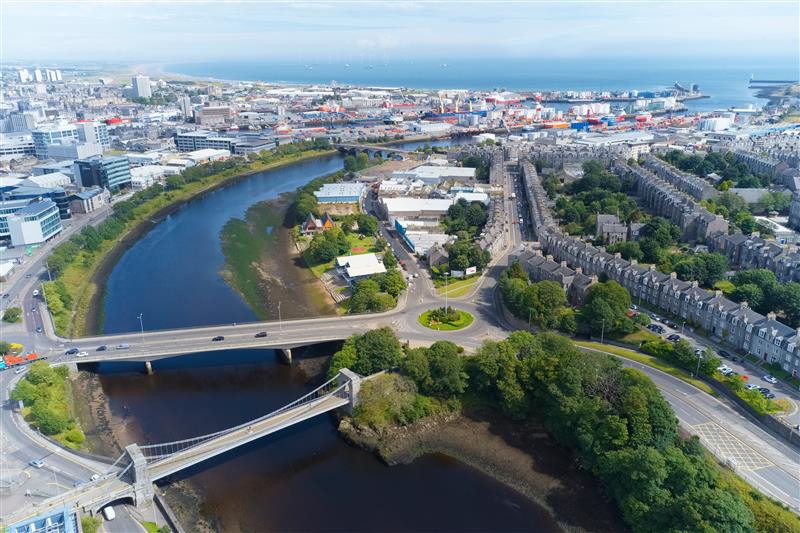 Photograph of an aerial view of Aberdeen showing a river the sea and buildings